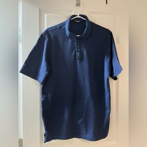 NWOT men’s Sunice navy blue short sleeve golf shirt.